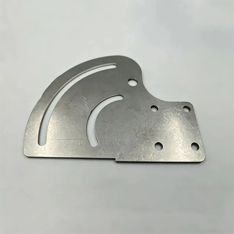 Two arc-shaped metal plates with elongated slots and circular holes